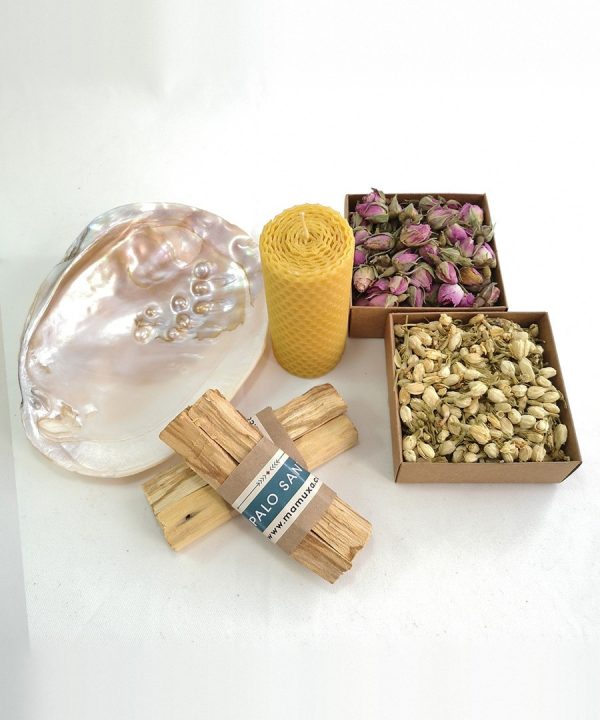 Mother-of-pearl shell, beeswax candle, palo santo and dried rosebuds and jasmine